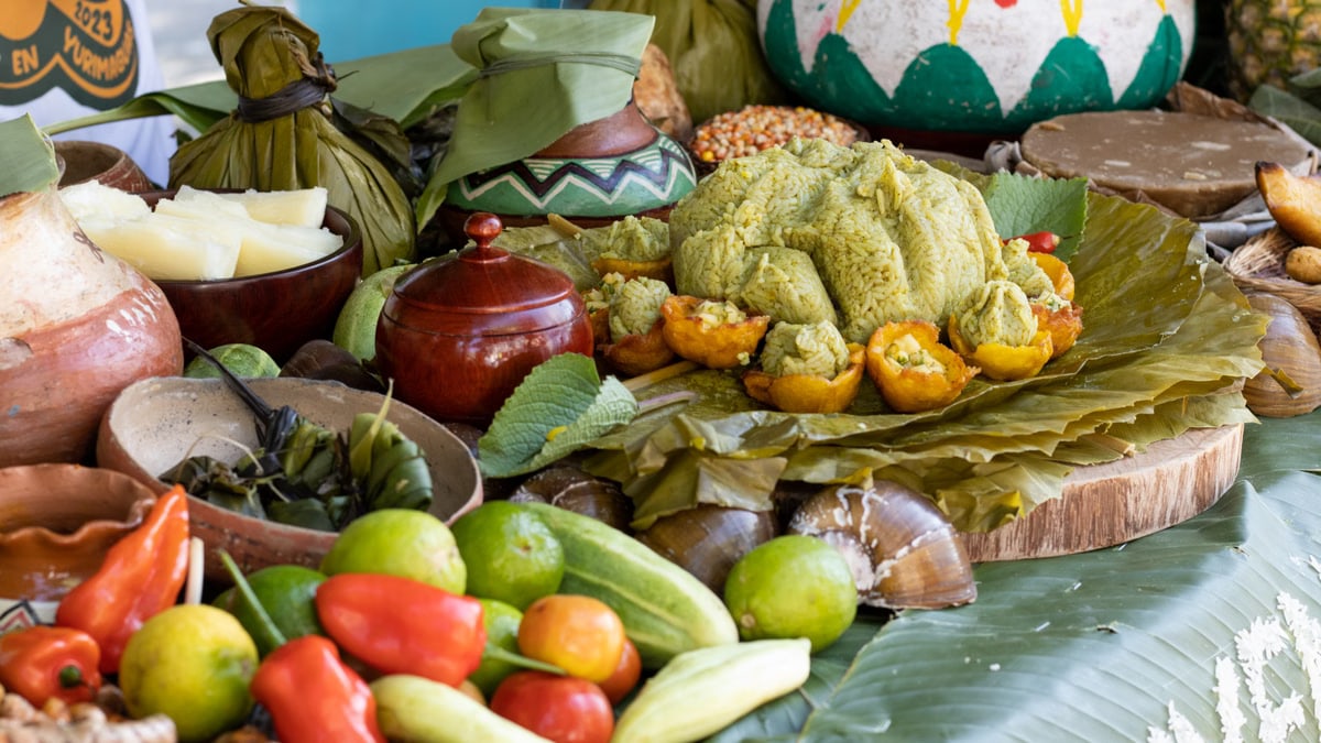 Traditional Amazonian cuisine featuring juane and local produce in Yurimaguas, Peru.
